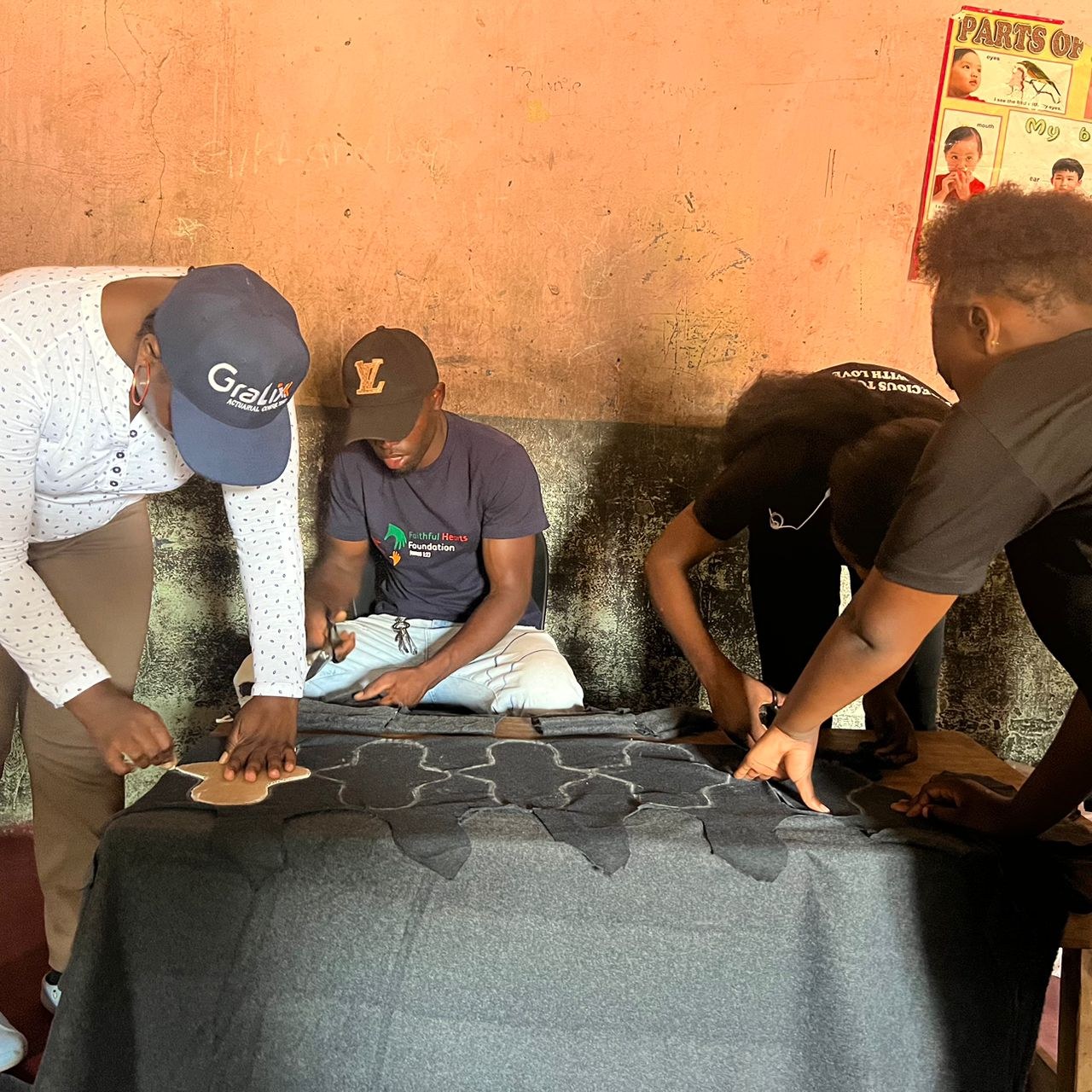 Volunteers preparing reusable menstrual pad materials during a workshop